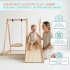 Drewniany domowy plac zabaw ze zjeżdżalnią, ścianką wspinaczkową i huśtawką